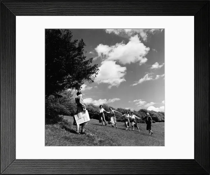 Framed Print : A group of women holding hands as they walk on Box Hill, Surrey. June 1952 Framed Print : A group of women holding hands as they walk on Box Hill, Surrey. June 1952