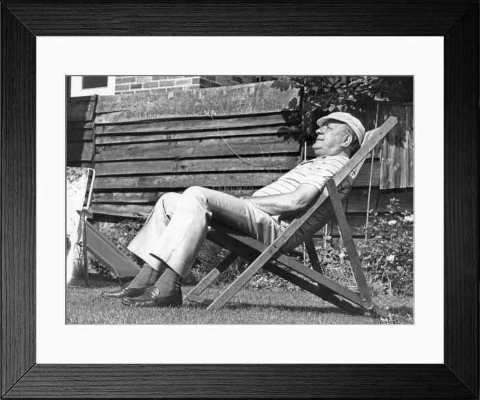 Framed Print : Liverpool manager Bob Paisley enjoys the sunshine as he sits in a deckchair in the back Framed Print : Liverpool manager Bob Paisley enjoys the sunshine as he sits in a deckchair in the back