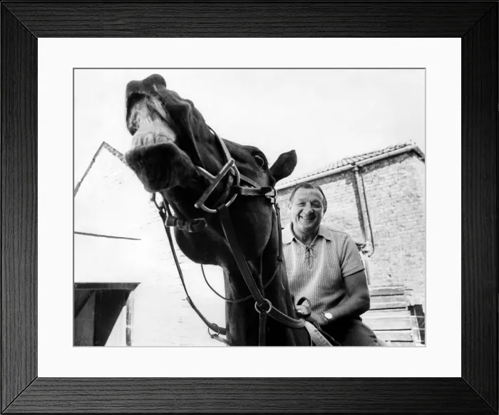 Framed Print : Liverpool manager Bob Paisley pictured on a racehorse at a racing stables. June 1976 Framed Print : Liverpool manager Bob Paisley pictured on a racehorse at a racing stables. June 1976