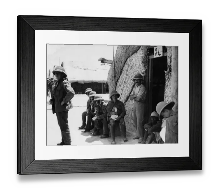 Framed Print : A wounded British soldier seen outside a hospital hut close to the Shatt al