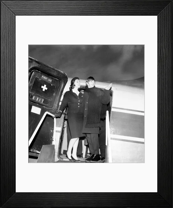 Framed Print : Beatles drummer Ringo Starr with air stewardess as he boards a plane