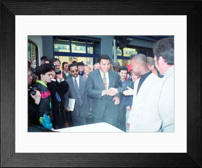 Framed Print : Boxing fans queue outside Dillions book store in Birmingham seen here greeting Muhammad Framed Print : Boxing fans queue outside Dillions book store in Birmingham seen here greeting Muhammad