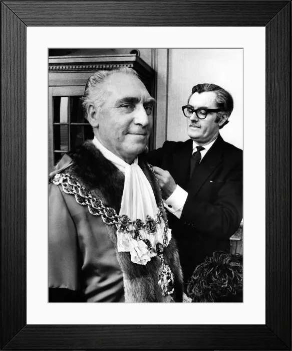 Framed Print : Councillor James Eames being robed by his attendant Mr. Tom Freer before being elected Framed Print : Councillor James Eames being robed by his attendant Mr. Tom Freer before being elected