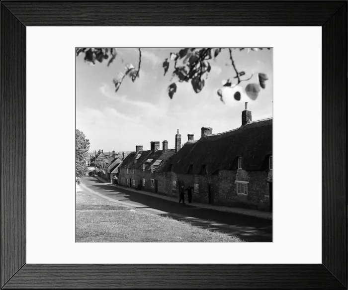 Framed Print : Corfe Castle village, Dorset. Circa 1952 Framed Print : Corfe Castle village, Dorset. Circa 1952