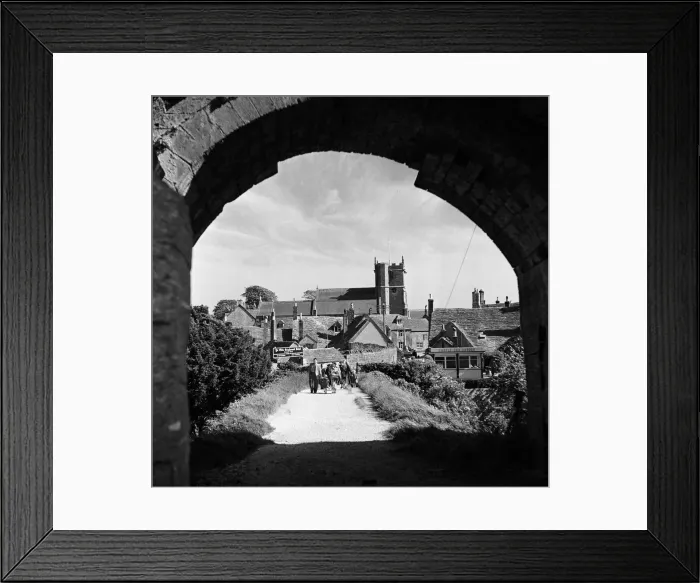 Framed Print : Corfe Castle village, Dorset. Circa 1952 Framed Print : Corfe Castle village, Dorset. Circa 1952