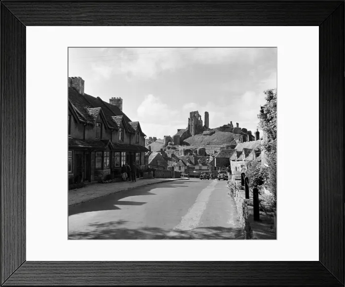Framed Print : Corfe Castle village, Dorset. Circa 1952 Framed Print : Corfe Castle village, Dorset. Circa 1952