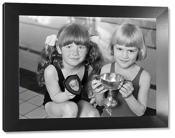 Six-year-old swimmer Charlotte Ann St Clair (right) is the '