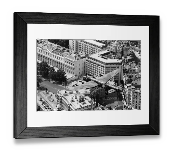 Framed Print : The RAFs only Lancaster bomber pictured in flight over Central London