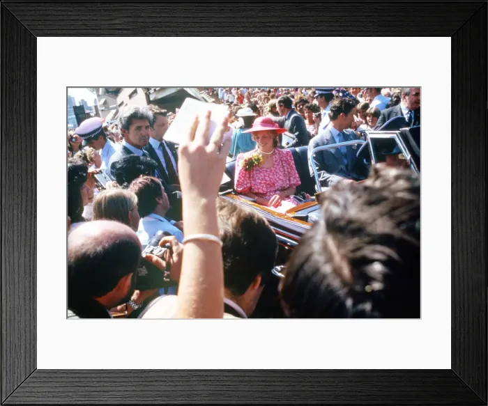 Framed Print : The Prince and Princess of Wales in a car driving through crowds of well wishers in front Framed Print : The Prince and Princess of Wales in a car driving through crowds of well wishers in front