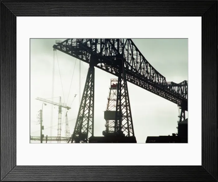 Framed Print : Tees Transporter Bridge, Middlesbrough, silhouetted against the midday sky Framed Print : Tees Transporter Bridge, Middlesbrough, silhouetted against the midday sky