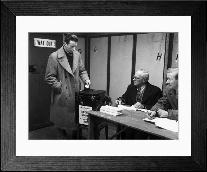 Framed Print : A Coventry voter casts his vote in the 1959 General Election at Cheylesmore polling