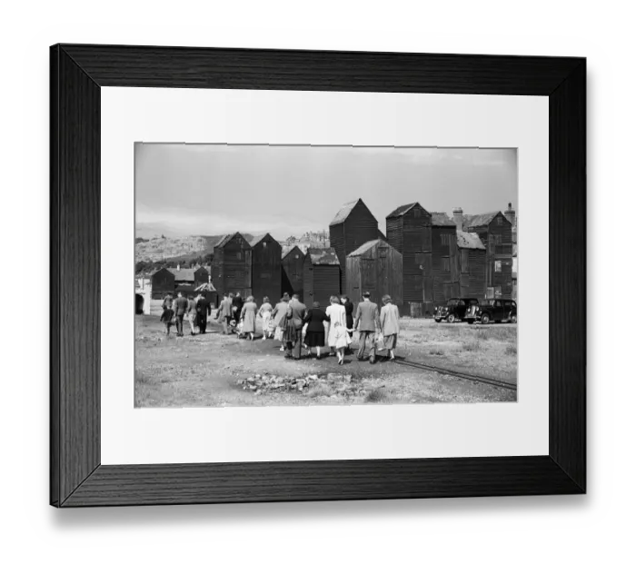 Framed Print : Holiday scenes. in and around Hastings, East Sussex Tourist walk along the seafront Framed Print : Holiday scenes. in and around Hastings, East Sussex Tourist walk along the seafront