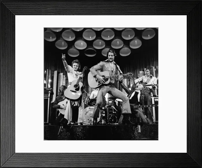 Framed Print : Leicester City footballer Frank Worthington dressed as Elvis Presley supported by