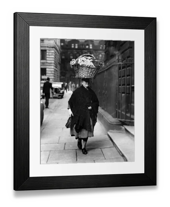 Framed Print : This 68 year-old flower seller of Liverpool presents an unusual picture as she carries