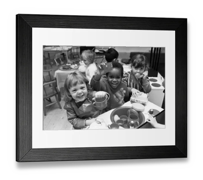 Framed Print : Two year old Heather Holberry and Duane Facey, 3, prove that washing up can be fun - but