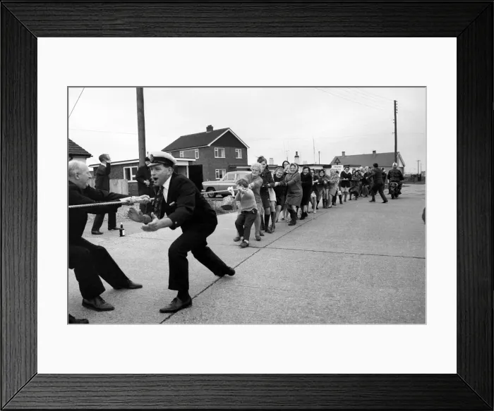 Framed Print : The annual Tug O war battle of the sexes took place yesterday outside the Pilot Pub