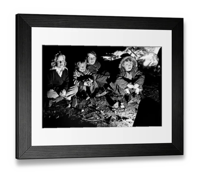 Framed Print : The thrills of Guy Fawkes night are reflected in the faces of these youngsters as they