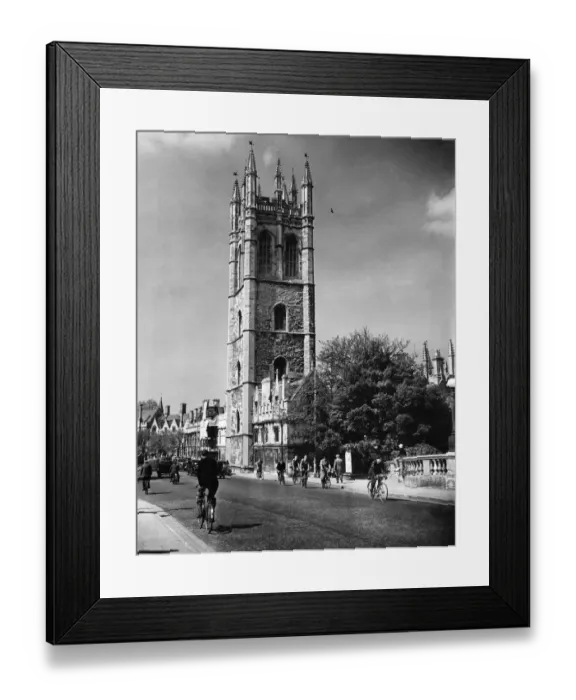 Framed Print : Cyclist in High Street, Oxford, cycling past Magdalen College, Oxfordshire Framed Print : Cyclist in High Street, Oxford, cycling past Magdalen College, Oxfordshire