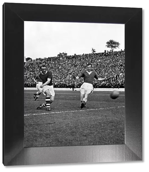 Jimmy Gauld, Charlton Athletics inside right, (left) shoots for goal