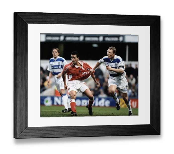 Framed Print : Clive Mendonca of Charlton has his shirt pulled by Tim Breacker of Queens Park Rangers