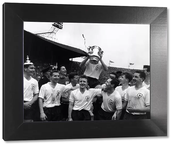 Tottenham Hotspur team celebrate with the FA cup trophy after their win over Leicester
