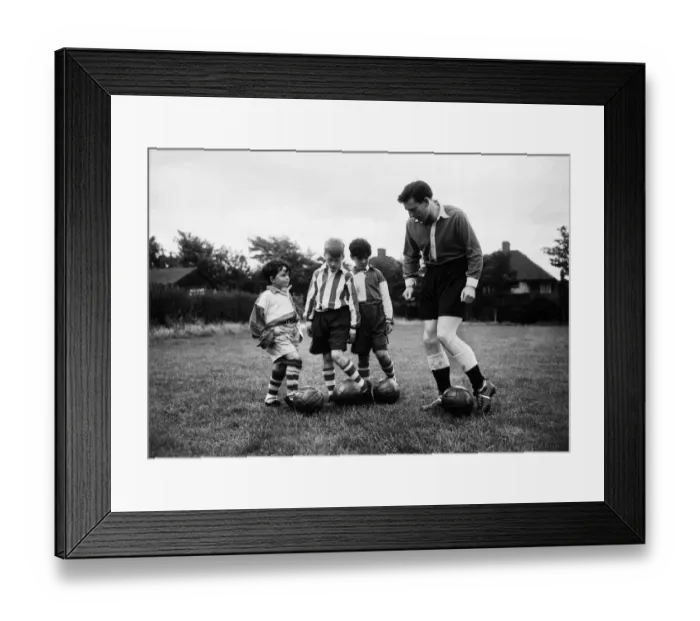 Framed Print : Charlton Athletic team training session. Team captain Derek Ufton talks to some local boy Framed Print : Charlton Athletic team training session. Team captain Derek Ufton talks to some local boy