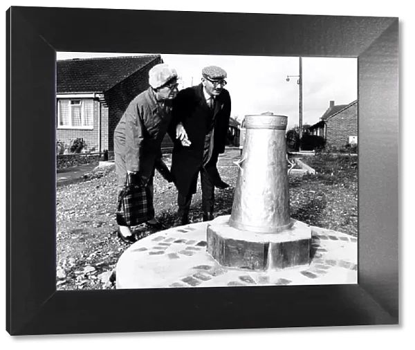 Mr and Mrs Caswell look at the Silver Jubilee Churn that was erected near Gillingham in