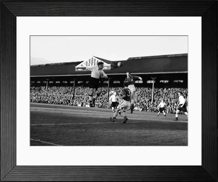 Framed Print : Fulham v. Leicester. Charlie Mitten of Fulham heads the ball. 3rd September 1952 Framed Print : Fulham v. Leicester. Charlie Mitten of Fulham heads the ball. 3rd September 1952