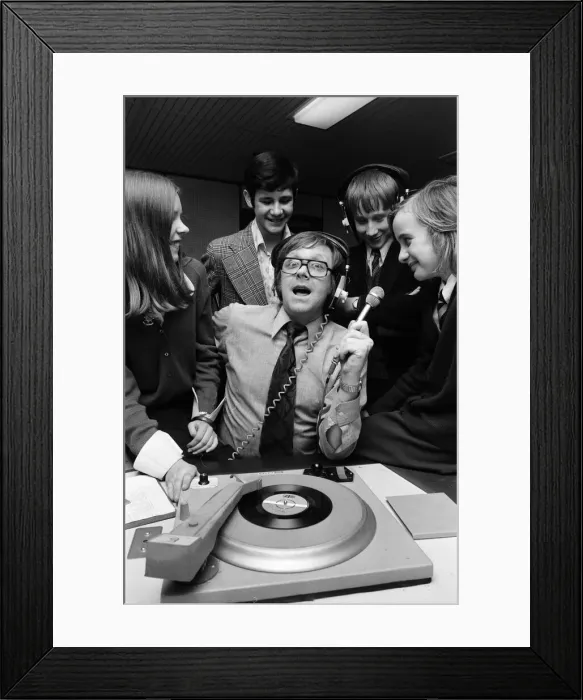 Framed Print : Ed Doolan BRMB Radio Disc Jockey, pictured with news boys and girls, Birmingham Framed Print : Ed Doolan BRMB Radio Disc Jockey, pictured with news boys and girls, Birmingham