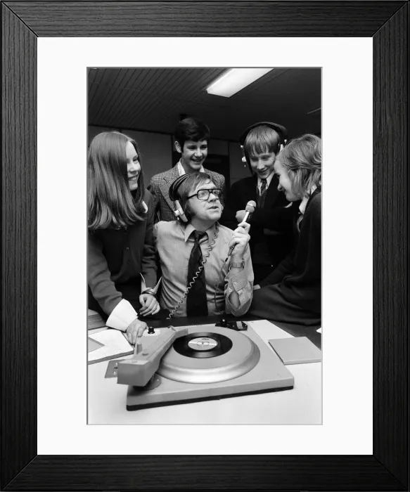 Framed Print : Ed Doolan BRMB Radio Disc Jockey, pictured with news boys and girls, Birmingham Framed Print : Ed Doolan BRMB Radio Disc Jockey, pictured with news boys and girls, Birmingham