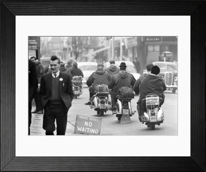 Framed Print : Mods on their scooters seen here leaving Clacton at the end of the bank holiday weekend Framed Print : Mods on their scooters seen here leaving Clacton at the end of the bank holiday weekend