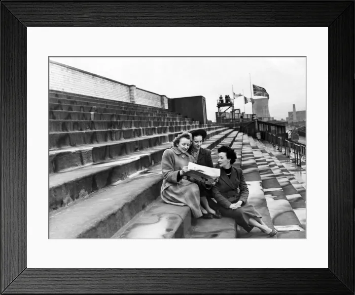 Framed Print : Three women checking the form in a newspaper at the Grand National race Framed Print : Three women checking the form in a newspaper at the Grand National race