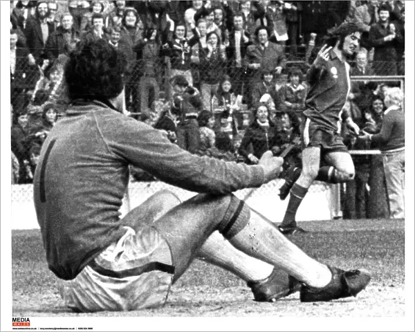 Cardiff Citys Robin Friday gives a two finger salute to Luton goalkeeper Milija