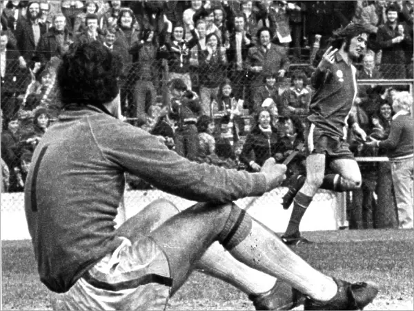 Cardiff Citys Robin Friday gives a two finger salute to Luton goalkeeper Milija