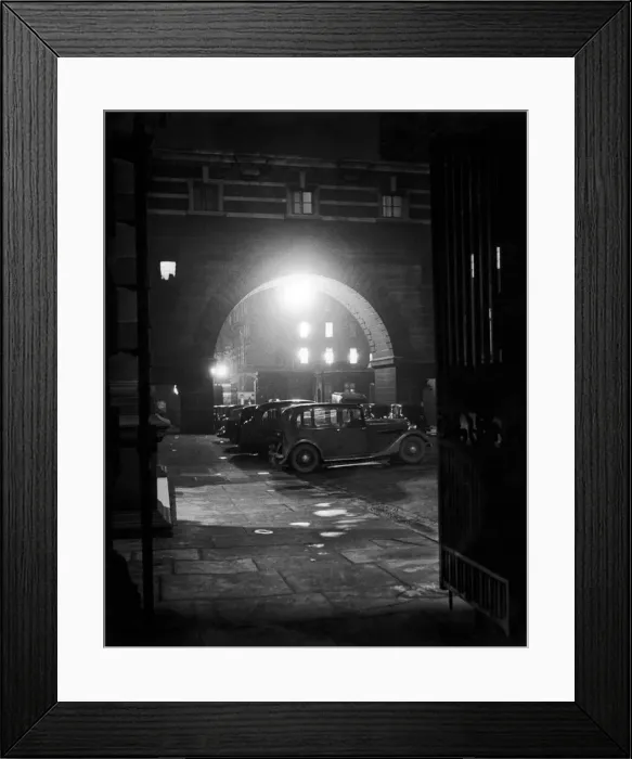 Framed Print : London by Night. View of motor cars parked outside Old Scotland Yard