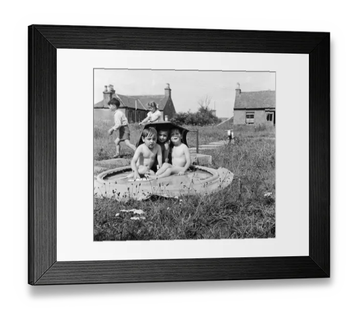 Framed Print : Children of Alexandra Day Nursery near Loch Lomond, Scotland cool off in a portable Framed Print : Children of Alexandra Day Nursery near Loch Lomond, Scotland cool off in a portable