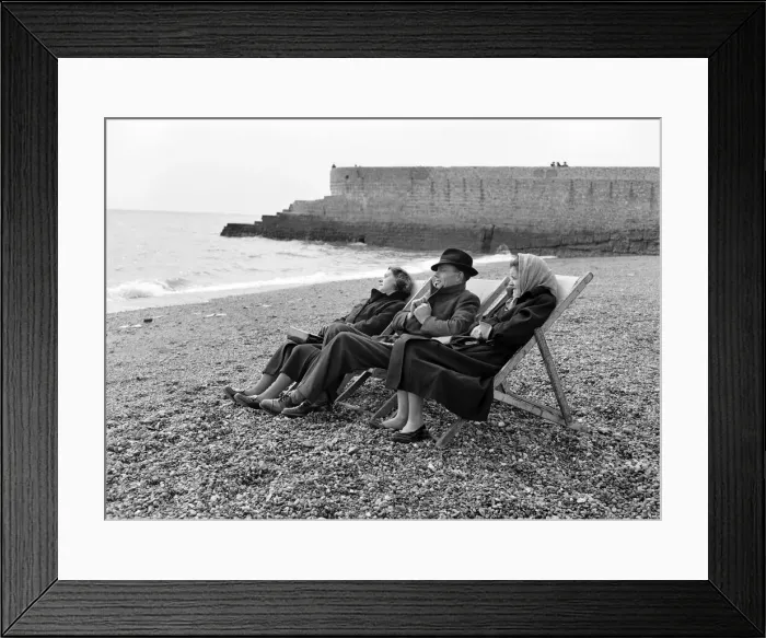 Framed Print : A family have the whole beach to themselves during a visit to the beach in Springtime Framed Print : A family have the whole beach to themselves during a visit to the beach in Springtime