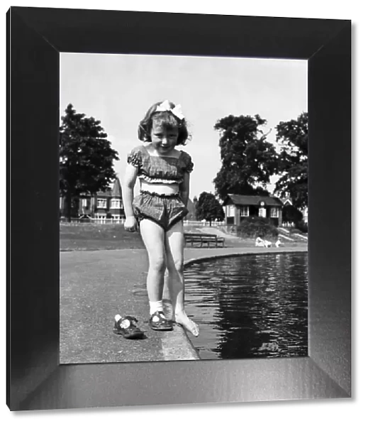 Holidays, little girl modelling swimsuit. June 1953 D3299-002