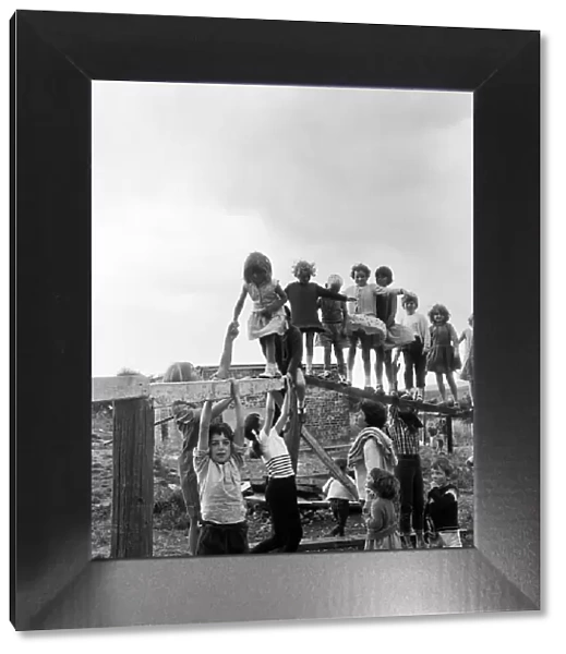 Children playing on climbing frames at the adventure playground in Moulsecomb, Brighton