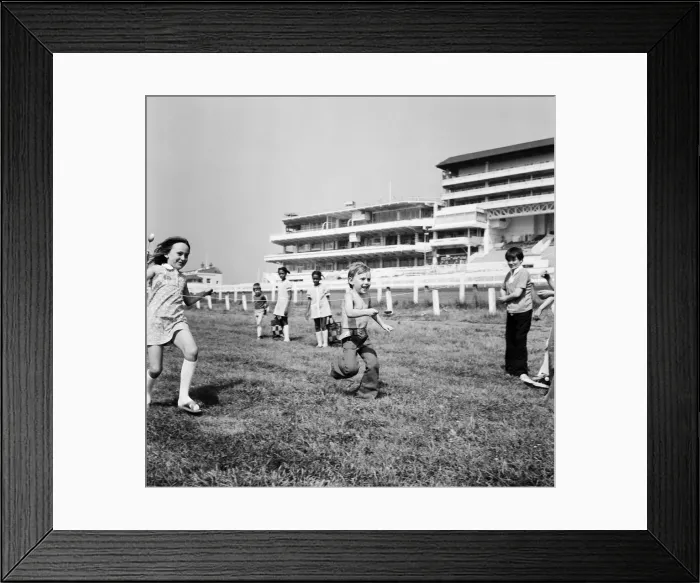 Framed Print : Children race across the finish line of the egg and spoon race on the Downs at Epsom Framed Print : Children race across the finish line of the egg and spoon race on the Downs at Epsom