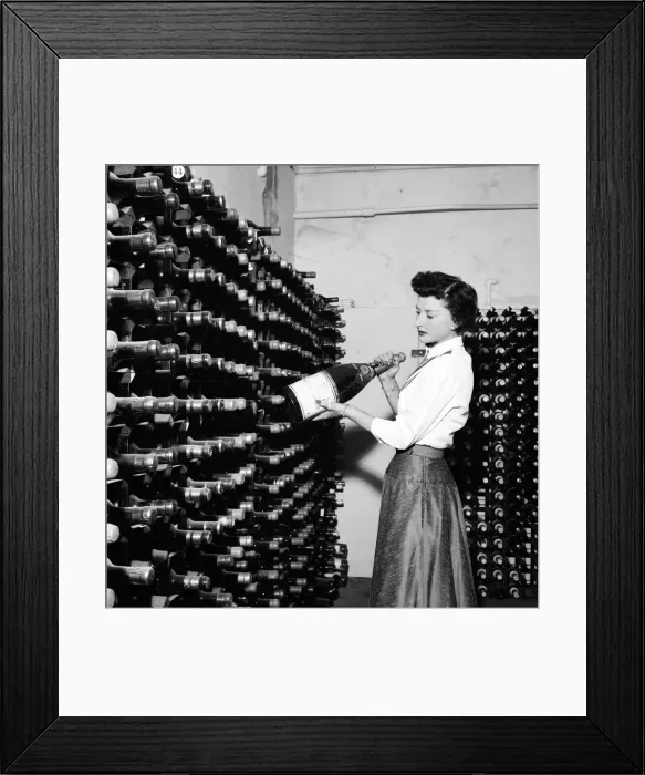 Framed Print : Woman seen here inspecting wine bottles. 1957 A17-001