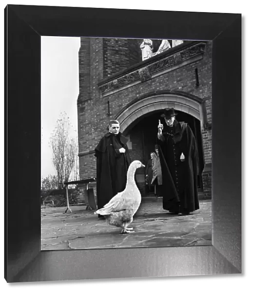 Monsignor Dunne and his pet goose Victor outside St Gregorys church, Preston