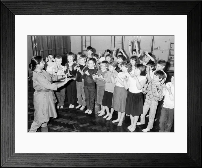 Framed Print : Mrs Piala Ray takes the children through an Indian dance class during the Kirklees Framed Print : Mrs Piala Ray takes the children through an Indian dance class during the Kirklees