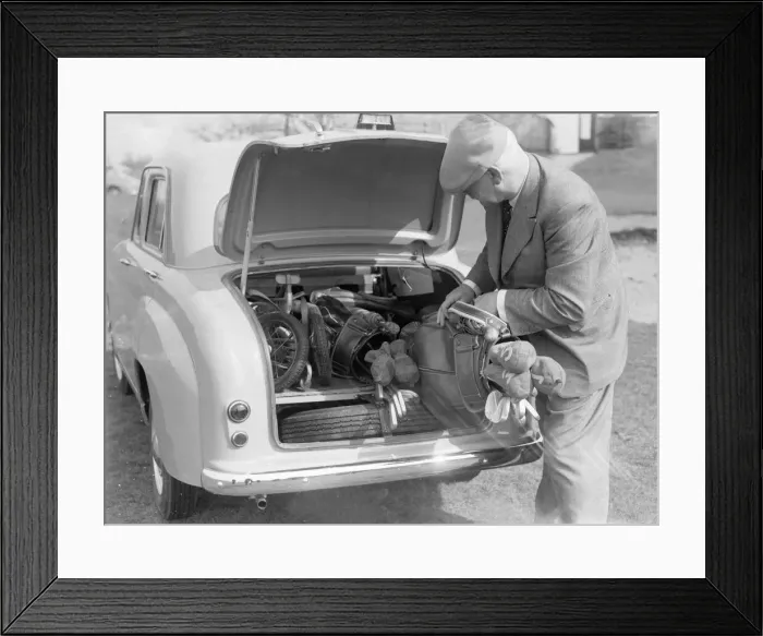 Framed Print : Golfer seen here storing his golf clubs in the boot of his brand new Standard 8 car Circa Framed Print : Golfer seen here storing his golf clubs in the boot of his brand new Standard 8 car Circa