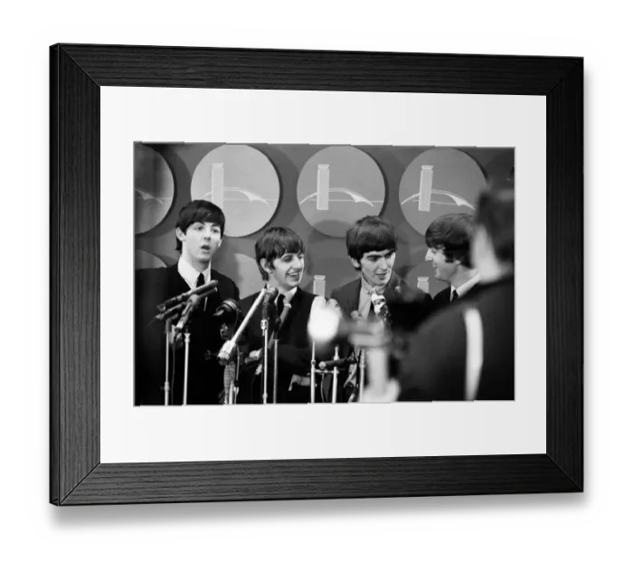Framed Print : The Beatles answer questions for newsmen and journalists in New York after their arrival