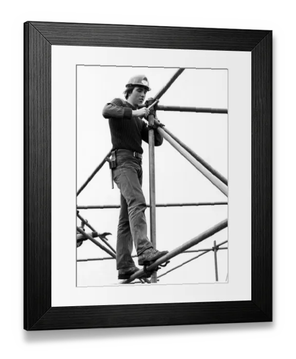 Framed Print : Stephen Swales, of Middlesbrough, stands tall as he fixes scaffolding Framed Print : Stephen Swales, of Middlesbrough, stands tall as he fixes scaffolding