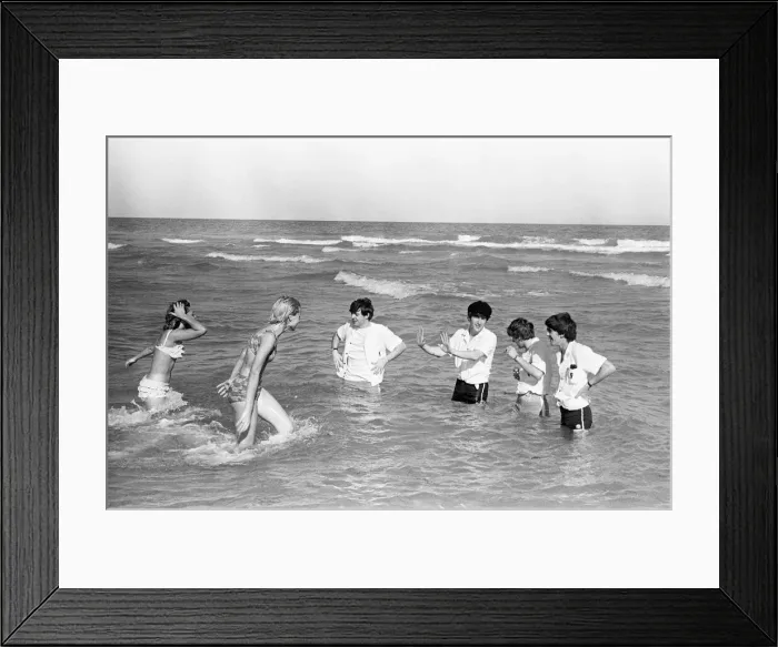 Framed Print : The Beatles in America, 18th February 1964. Having some fun on beach in Miami Framed Print : The Beatles in America, 18th February 1964. Having some fun on beach in Miami