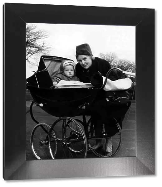 Mrs M Milburn with her grandson Francis John Woodley in his high pram on 23rd March 1961