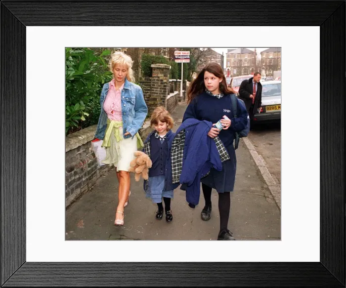 Framed Print : PAULA YATES WALKS TWO OF HER DAUGHTERS FIFI TRIXABELLE AND PEACHES TO SCHOOL TODAY