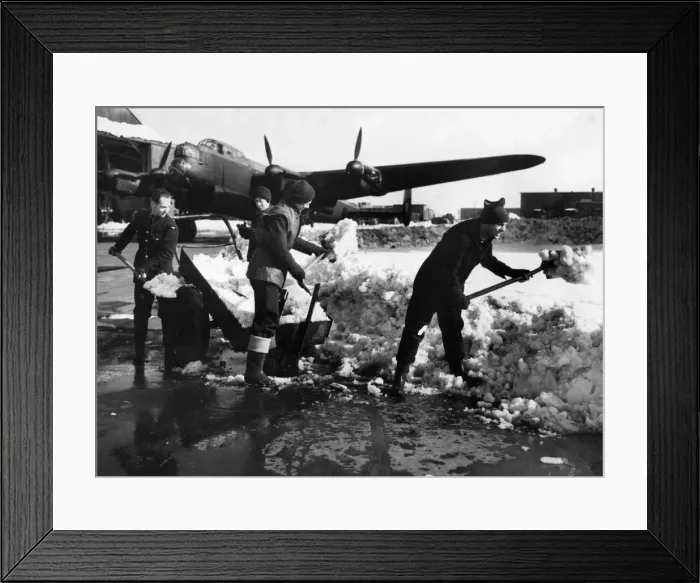 Framed Print : Warmly clad members of Ground Crew clearing away snow from a dispersl point at a bomber Framed Print : Warmly clad members of Ground Crew clearing away snow from a dispersl point at a bomber